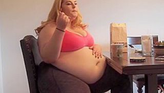 Blonde Plumper Rubs Her Belly While Eating Ice Cream