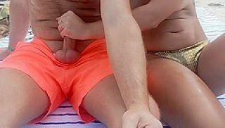 Topless On A Public Beach Walking Around And Giving A Handjob