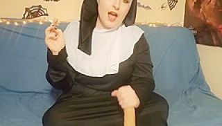 Nun Gives A Handjob To Her Dildo While Smoking