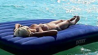 I Watched On The Beach How A Naked Girl With Big Tits Was Sunbathing On A Mattress. Slow Motion